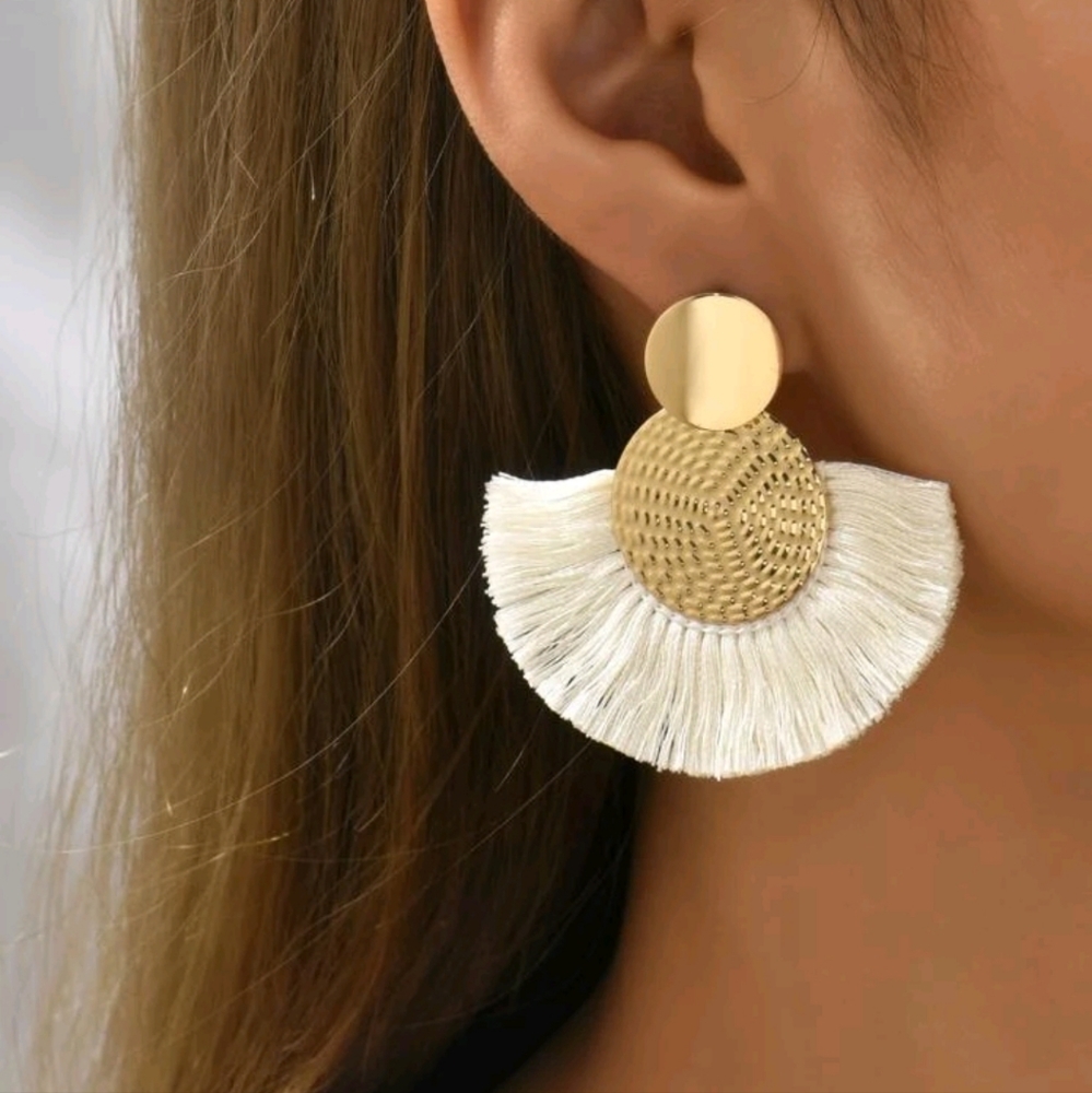New white tassel earrings.